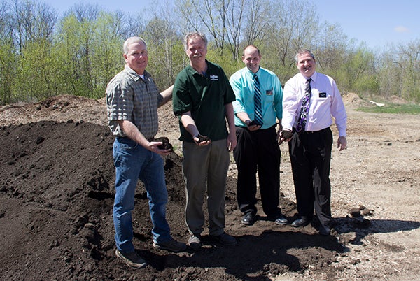 Albert Lea Parks Superintendent Joe Grossman stands with Andy Nelson, Jon Schlachter and Peter Streit of Hy-Vee with the donated compost. - Sarah Stultz/Albert Lea Tribune