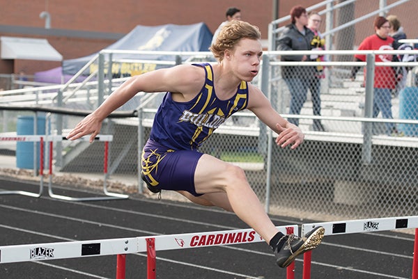 Lake Mills’ Grant Fjelstad competes in the shuttle hurdles relay event Tuesday during a track and field meet at Garner-Hayfield-Ventura. - Lory Groe/For the Albert Lea Tribune