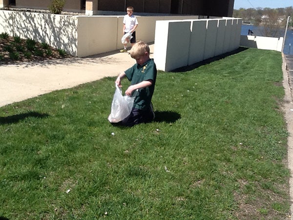 Students from St. Theodore School picked up garbage around the school, library and by the post office as a part of Earth Day activities. The students plan to do more cleanup during the month of May as a part of a service project. -Provided