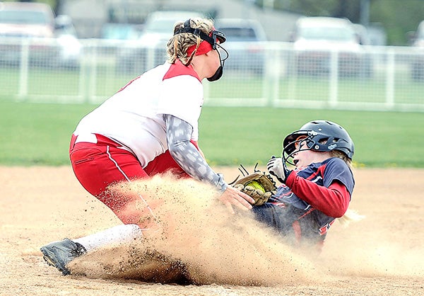 Albert Lea’s Liana Schallock gets in under the tag of  Austin’s Brandi Myers during their game Tuesday at Todd Park in Austin. - Eric Johnson/Albert Lea Tribune