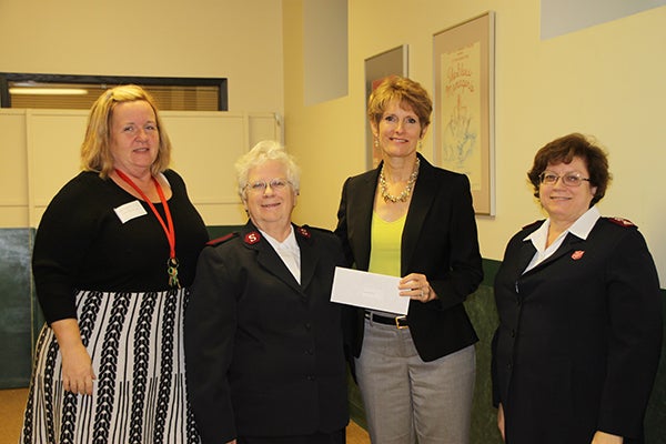Marilynn Lancaster, Elsie Cline and Louise Delano-Sharpe from Salvation Army accept a donation from Jillian Peterson, board chairwoman of the Freeborn County Community Foundation. -Provided