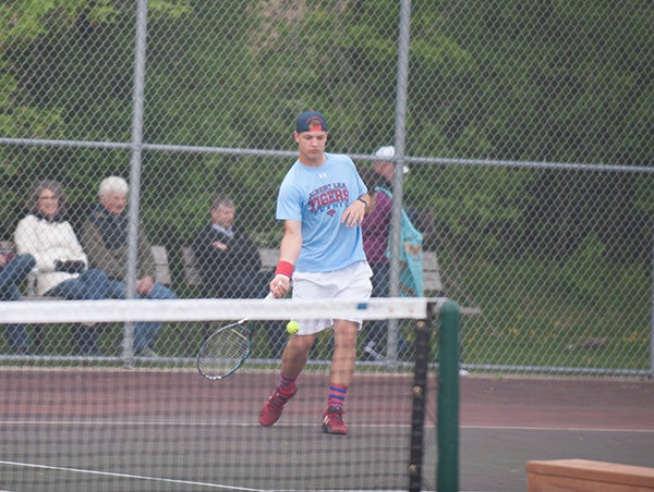 Tigers’ Foster Otten plays the ball in his singles match Tuesday evening. Otten won his match 7-5, 6-2. 
