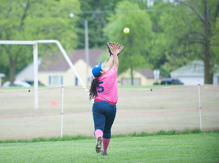 Albert Lea outfielder Meliza Lopez chases down a fly ball in the first inning of Game 1 against Mankato East Thursday afternoon. Jarrod Peterson/Albert Lea Tribune