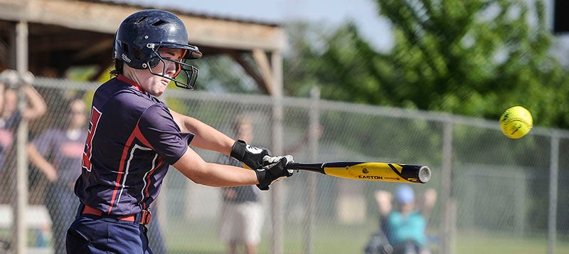 Albert Lea’s Dayna Edwards connects on a pitch in its section softball game against Stewartville Thursday night in Austin. Albert Lea fell to Stewartville, 6-2, ending its season. Eric Johnson/ Albert Lea Tribune