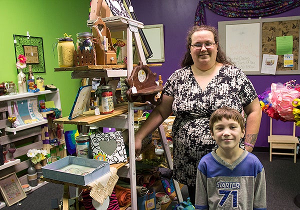 Mindy Christenson, owner of Mama’s Gift Corner, stands with her son Saxon in the store. Christenson opened the store March 1 in  Skyline Plaza. - Sarah Stultz/Albert LEa Tribune