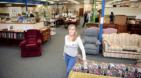 ReStore manager Lynn Nuckolls stands at the front of the ReStore which takes in items from the community and sells them at reduced prices. - Eric Johnson/Albert Lea Tribune