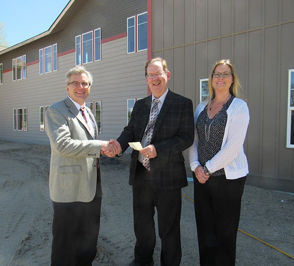Security Bank Minnesota donates $25,000 to the St. John’s capital campaign for the completion of the town center. Scot Spates, CEO of  St. John’s Lutheran Community, accepted a check from Tim Lenhart, president, and Julie Claussen, vice president of Security Bank Minnesota. -Provided