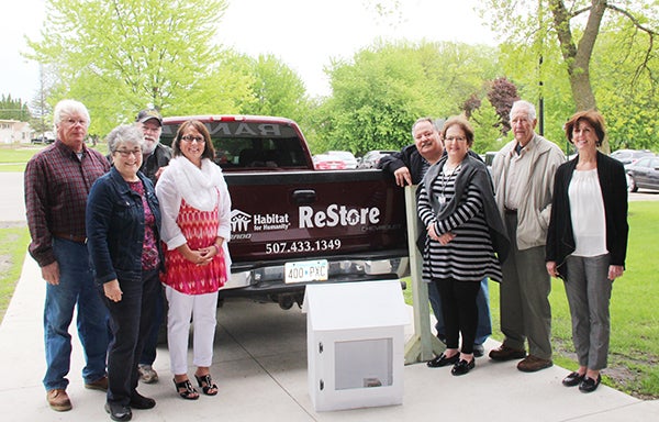 Representatives from the Albert Lea school district accept Little Free Libraries, donated by the Albert Lea Rotary Club. The Little Free Libraries and stands were built by Freeborn-Mower Habitat for Humanity. Pictured on the left are Cassey Swesnson, Bill Danielsen, Marilyn Danielsen and Diane Shultz. Pictured on the right are John Forman, Mary Jo Dorman, Earl Jacobson and Karen Zwolenski. - Provided