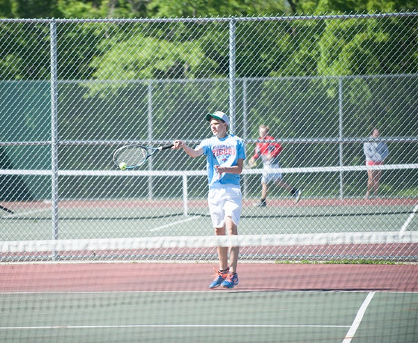 Grant Herfindahl was locked in a battle with his opponent Tuesday. Like all the Tigers, Herfindahl was able to win his match 6-2, 6-0. Jarrod Peterson/Albert Lea Tribune