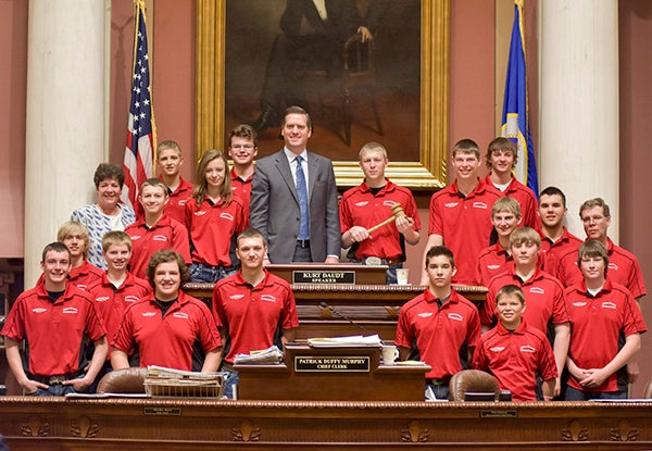 District 27A Rep. Peggy Bennett, R-Albert Lea, honored the Alden-Conger supermileage team for winning the Shell Eco-Marathon in the Urban Concept division at the national competition in Detroit. The team now heads to London to compete in the Shell Eco-Marathon Europe. Bennett and the Minnesota House of Representatives honored the team with a House resolution and a standing ovation from all members. Here, the team is pictured with Bennett and Speaker of the House Kurt Daudt. -Provided
