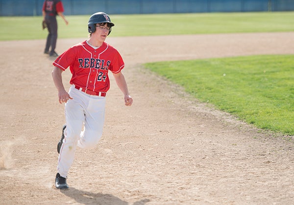 United South Central's Billy Gimberline rounds third during Friday's game against St. Clair at Thompson Park. 