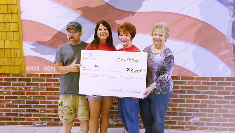Freeborn County Bike-A-Thon committee members Ken Dreyling, Jodi Dreyling, LeAnn Juveland and Cheryl Moran hold a check representing the $24,476.30 raised during this year’s event. Committee members Kent Erlandson and Dave Villarreal are missing from the photo. - Provided