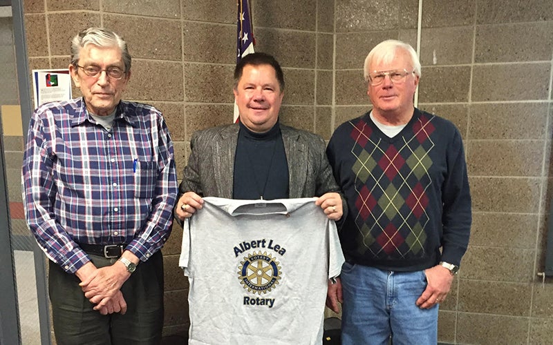 New member Don Malinsky accepts his Rotary shirt from Art Smith and Casey Swenson. - Provided