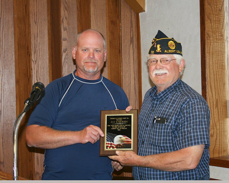 Jay Enderson, left, was presented an award by Dave Mullenbach for his outstanding service as the American Legion baseball coach for the past 10 years and his service to Albert Lea Post 56. Provided