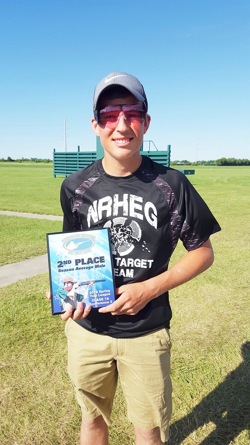 NRHEG’s Collin Christenson hold his plaque for the finishing with the second-highest average for Conference 3, Class 7A during the Minnesota state tournament for Clay Target Shooting. - Provided