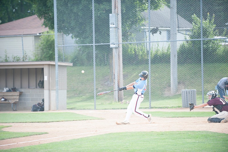 Post 56’s Jake Thompson launches a fly ball in an at-bat in the third inning of Albert Lea’s game against Rochester Thursday evening. He later homered in the sixth inning.