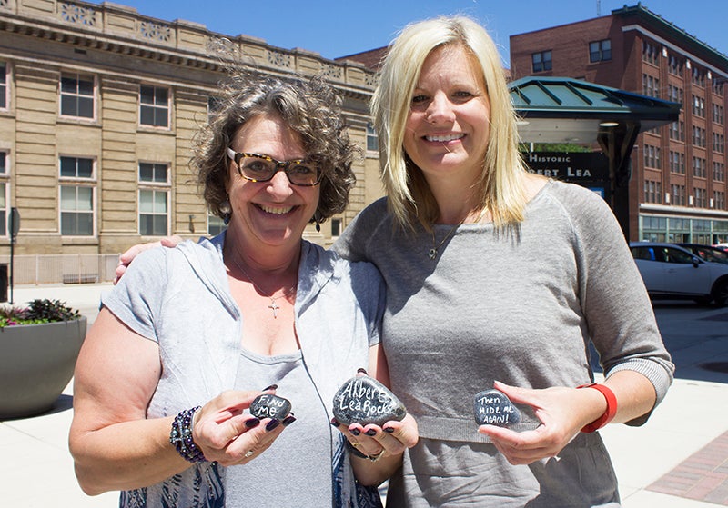 Dori Etheridge and Kari Ulrich are heading up a new community initiative called Albert Lea Rocks. The initiative encourages people to paint and hide rocks and showcase positive messages about the community. - Sarah Stultz/Albert Lea Tribune