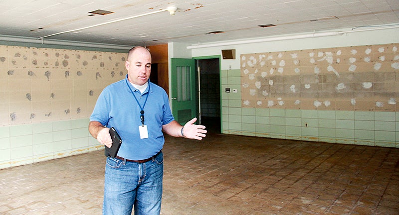 Director of Facility Services Mat Miller talks in a room at the former Corcoran Center that will be converted into a classroom for the Austin-Albert Lea Special Education Cooperative. - Jason Schoonover/Albert Lea Tribune