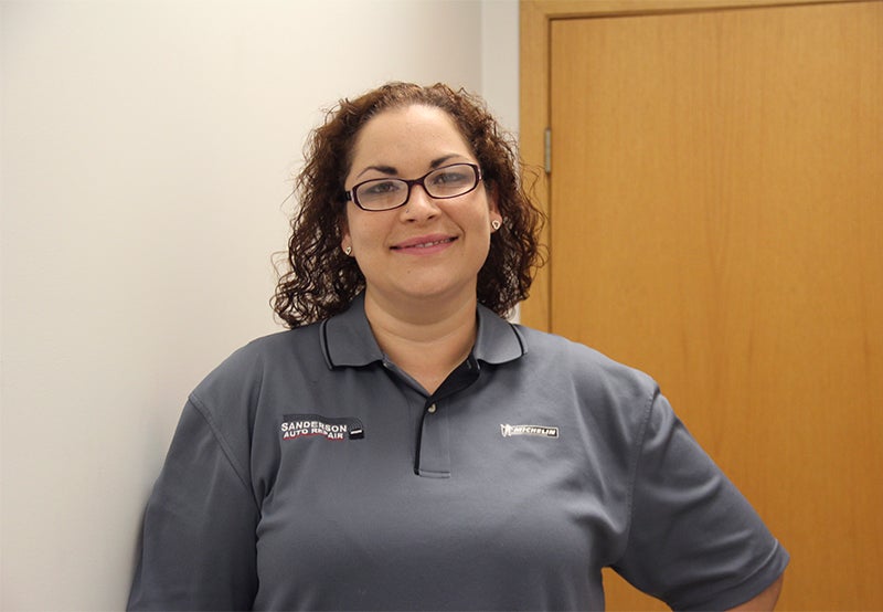 Katy Garcia of Austin enjoys working with the customers at Sanderson Auto.  - Emily Wangen/Albert Lea Tribune