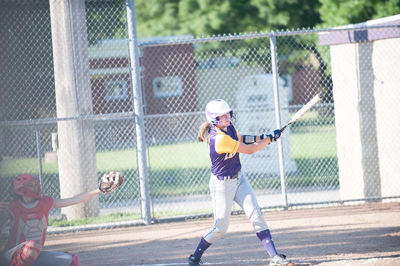 Lake Mills sophomore Mallory Wilhelm connects on a pitch for a base hit in a game earlier this season. Wilhelm had one of the four hits for the Bulldogs in Tuesday’s loss to the Saints. Jarrod peterson/Albert Lea Tribune