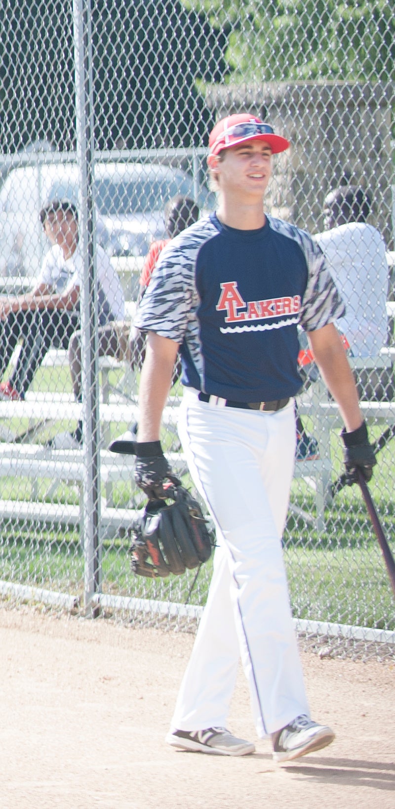 Thompson makes his way toward the batting cage as a member of the Albert Lea Lakers before Thursday’s game against the U.S. Military All-Stars.