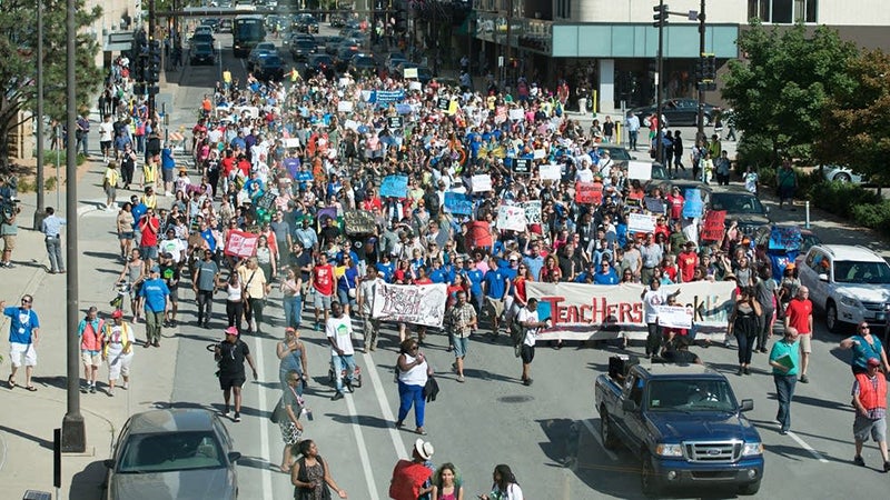Hundreds of educators and activists march in downtown Minneapolis. - Angela Jimenez/For MPR News
