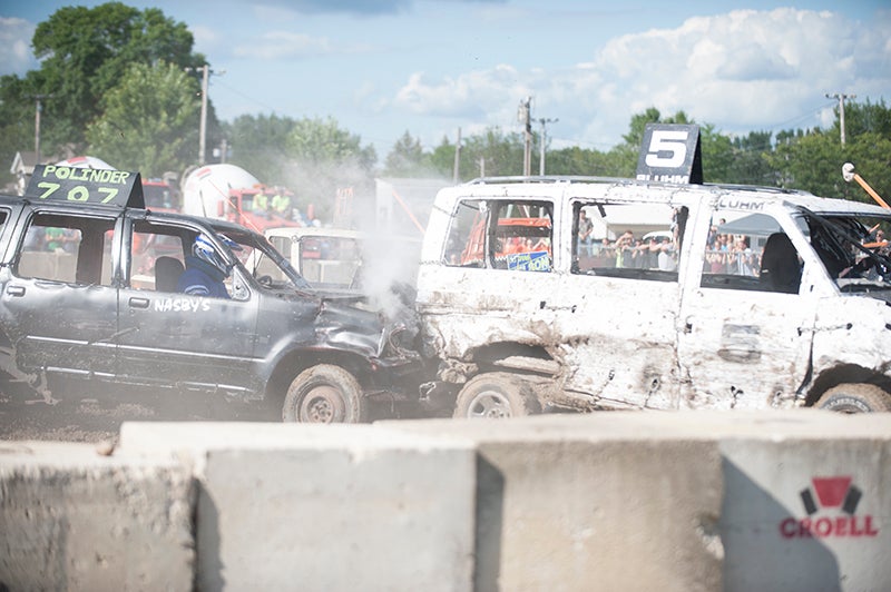 Michael Polinder hits Nate Bloom from behind in the minivan division during Sunday’s demolition derby at the Freeborn County Fair. - Jarrod Peterson/Albert Lea Tribune