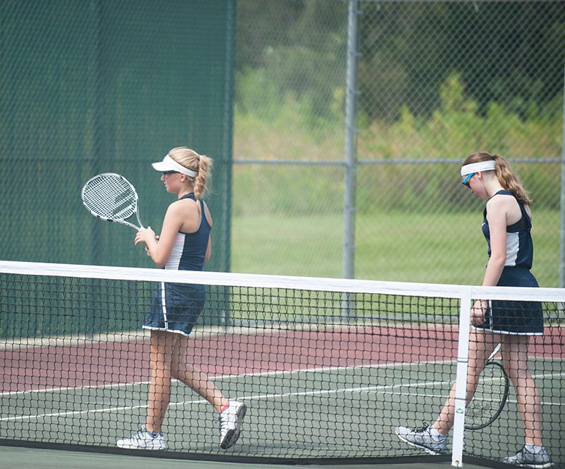 Albert Lea's Brooke Maier (left) and Maggie Moller walk off the court after their doubles' match against Rochester Mayo's Rachel Zhang and Connie Chen Tuesday.