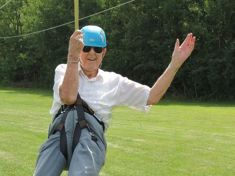 Dick Thunstedt zipping down the zipline at Camp Courage. - Provided