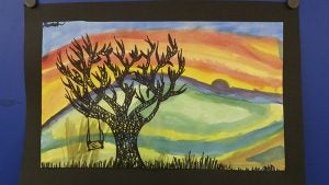 Fifth-grade art by Alannah Flatness at Lakeview Elementary School. It includes watercolor and ink mixed media. Provided