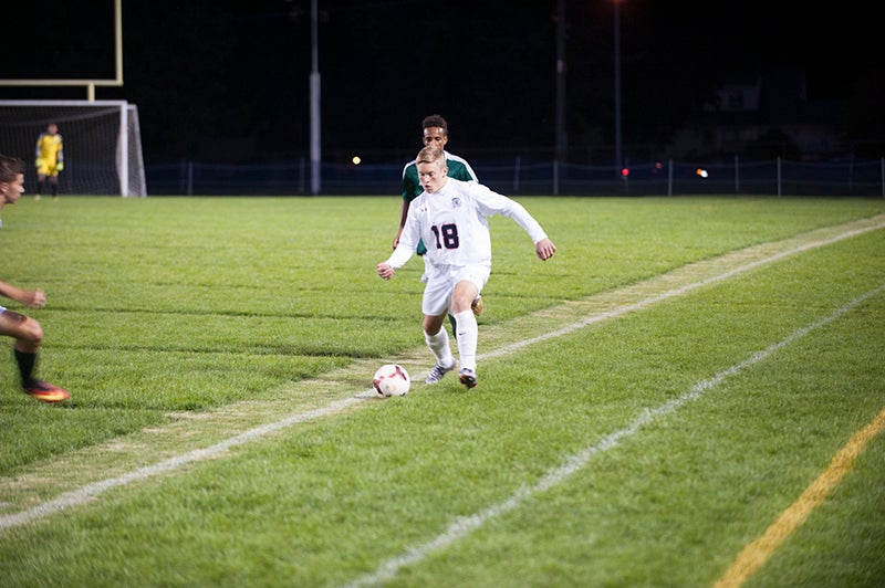 Albert Lea’s Drew Sorenson looks to pass the ball ahead to a teammate during the seoncd of Tuesday’s game against Faribault. Jarrod Peterson/Albert Lea Tribune