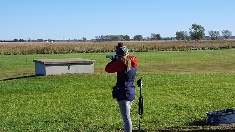 Morgan Phillips, of Albert Lea High School, takes aim during a recent clay target tournament. She is currently top 25 in the conference for female averages. provided