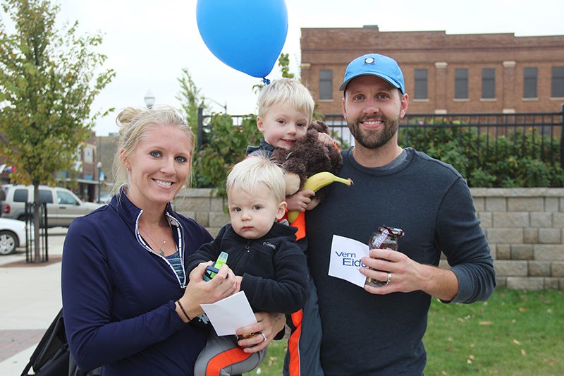 Emma Habben and her husband, Mark, were the first-place finishers in both the women and men's categories at the Splash Dash 5k. They each won a free oil change from Vern Eide, along with a cup full of treats. Here, they are pictured with their sons, Finn, 1 1/2, and Logan, 3. Provided