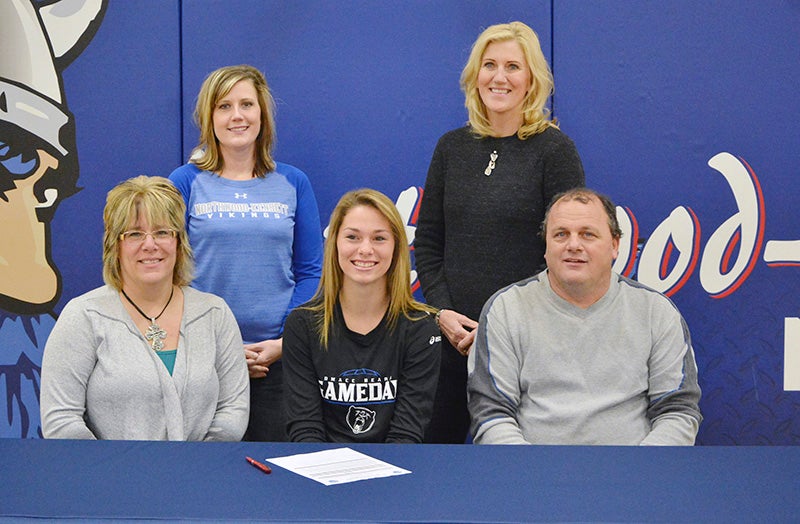 From left, front row are Becky Haberman, Terran Haberman and Brian Haberman. Back row, from left are Heather Rheingans and Des Moines Area Community College coach Patty Harrison. Terran Haberman signed her letter of intent to play volleyball for Harrison at DMACC on Wednesday. Provided