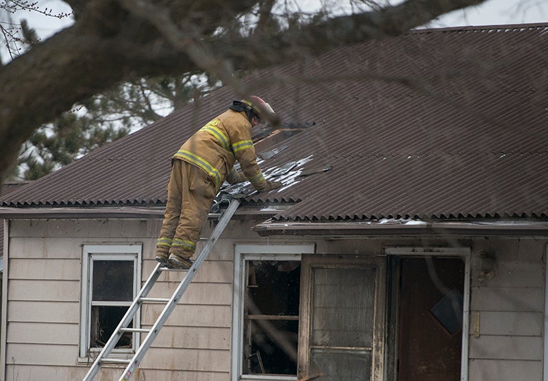 Firefighters returned to a house north of Emmons on Thursday after reports that the house was rekindling following a fire at the house Wednesday night. - Colleen Harrison/Albert Lea Tribune