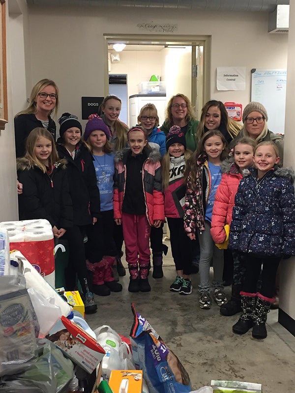 The Humane Society of Freeborn County received a donation of supplies, which were collected from the  dancers of the Albert Lea Just For Kix dance studio. Dancers include, front row, Makenna Oderkurk, Aryah Hansen, Sydney Newman, Zoie Jensen, Steph and Jessica Vogt, Brielle Bakken, Claire Kresbach, Nataleigh Nelson and Isabelle Steele. Also pictured are Just for Kix Director Holly Jackson, Humane Society Director Christa DeBoer and coaches Presley Duenes and Jena Inderlie. - Provided