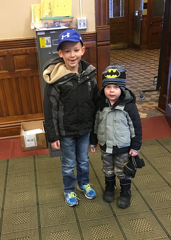 Milo and Luca Cafourek delivered gift bags for children that may come into to the Albert Lea Crime Victims Crisis Center with their parents who are victims of crime. The boys delivered the bags in December, however, their mother, Stacy Cafourek, raised money to purchase the gift bag items through a book sale in November. - Provided