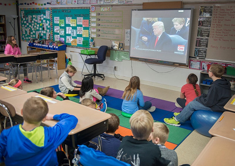 Donald Trump's inauguration was projected on a screen Friday morning for student's in Kelly Nellermoe's fifth-grade class at Sibley Elementary School. - Colleen Harrison/Albert Lea Tribune