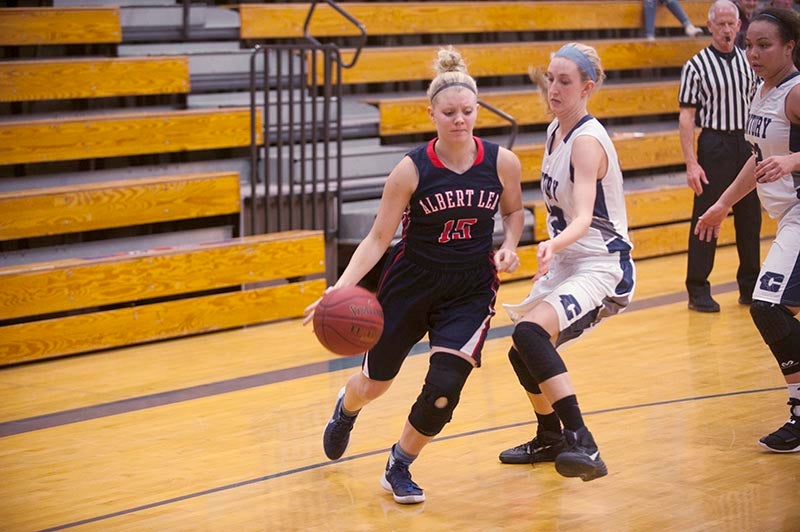 Tigers forward Kalli Citurs drives by Panthers forward Mariah Nadolny in the second half of Albert Lea’s 49-39 victory over Rochester Century at Albert Lea High School Tuesday night.