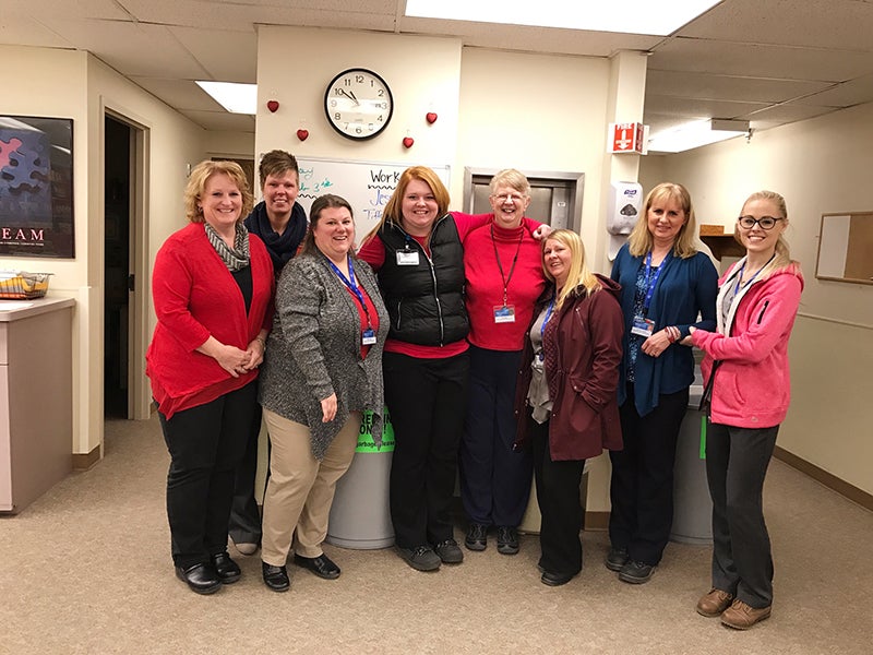The Mayo Clinic Health System document imaging team in Austin dress in red to demonstrate their support of the Go Red For Women campaign. - Provided