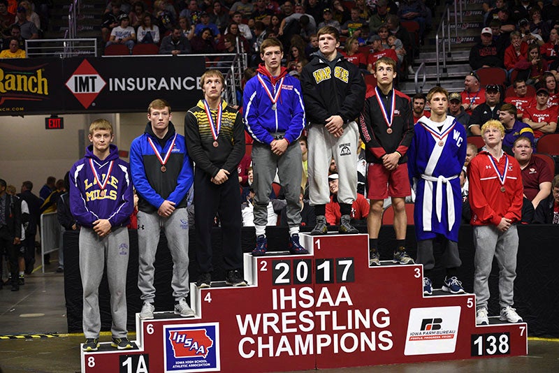 Cael Boehmer (far left) took eighth place in the Class 1A 138-pound class. Lory Groe/For The Albert Lea Tribune