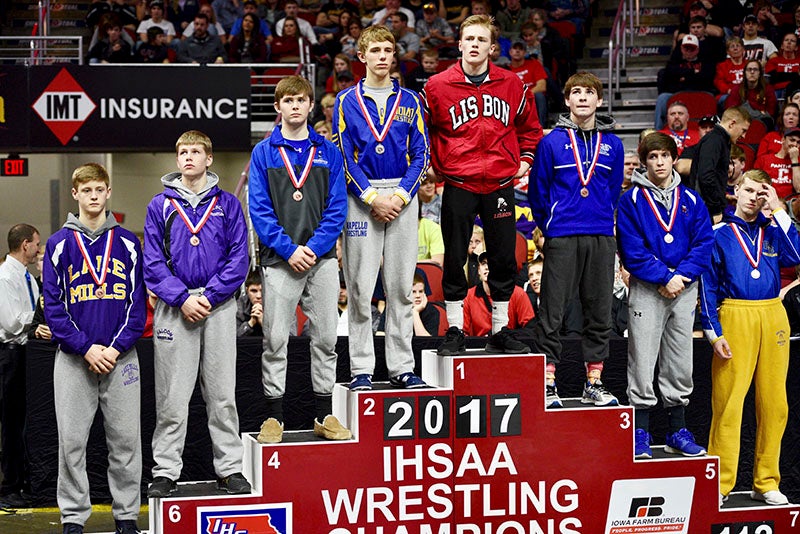 Tyler Helgeson (far left) took eighth place in the Class 1A 113-pound class. Lory Groe/For The Albert Lea Tribune