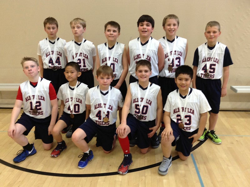 The Albert Lea Fifth grade boys’ traveling basketball team captured the consolation championship in the Austin tournament on Saturday. After losing to Austin in the first game, it defeated Byron and Rochester Lourdes to earn the consolation trophy. From left, front row, are Henry Buendorf, David Li, Luke Olson, Jack Skinness and John Vu. From left, back row, are Kaiden Johnson, Grant Adams, Max Irvine, Spencer Jones, Bowen Jensen and Aidan Hartman. The team will conclude its season at the Fairmont tournament this weekend. Provided